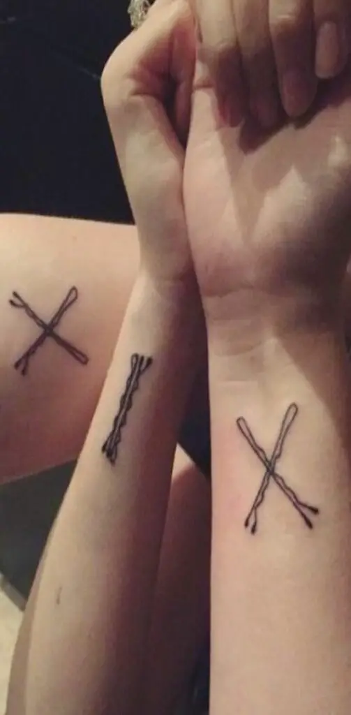 2 bobby pin creating an x-shaped tattoo
