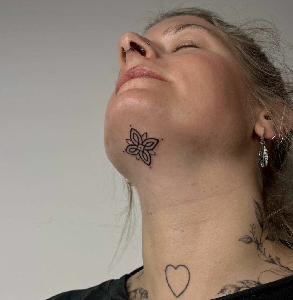 Chin tattoo